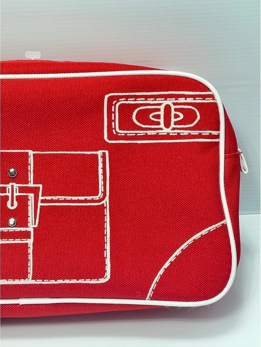 Clinique Red Canvas Cosmetic Bag with White Image Stitching and Zipper Closure